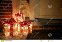 Lighted Decorated Christmas Gifts Boxes At Doorway Stock Image regarding proportions 1300 X 957